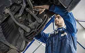 mechanic working on suspension